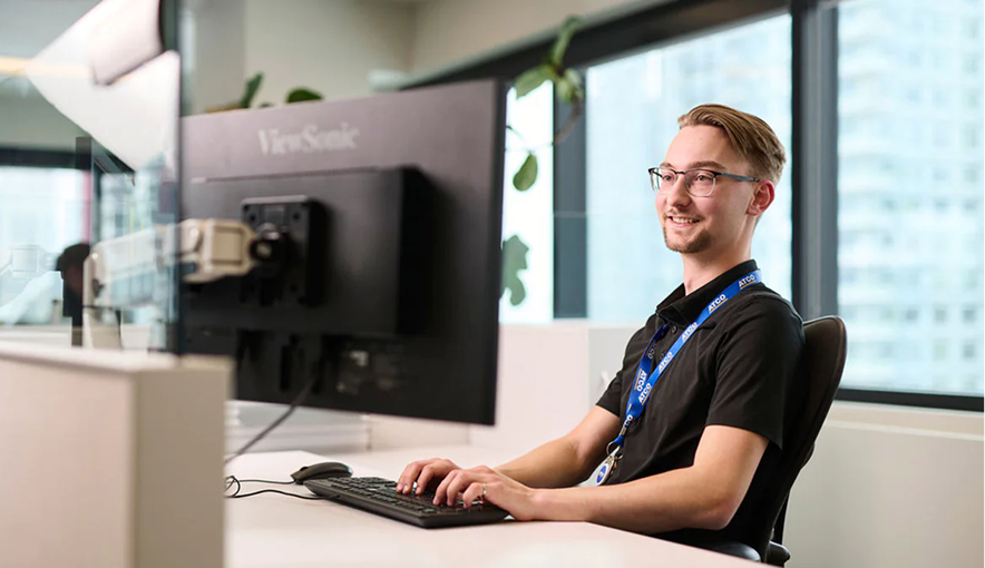 Person completing orientation training at a computer